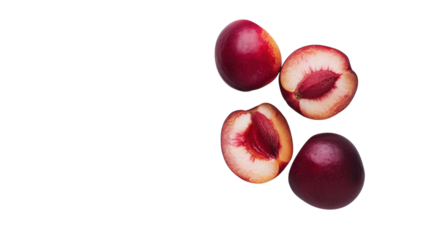 Juicy red plums sliced open revealing vibrant flesh against a bright yellow backdrop creating a warm summer vibe