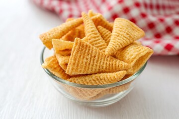 Clear cup of corn snack ,crispy corn snack on white background
