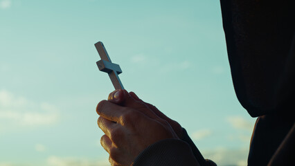 Christian man prays in the early hours of the day