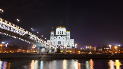 Majestic orthodox Cathedral of Christ Saviour and bridge at dusk on bank of Moscow river. Timelapse hyperlapse, Russia