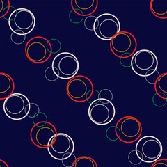 Seamless pattern with colored rings on dark