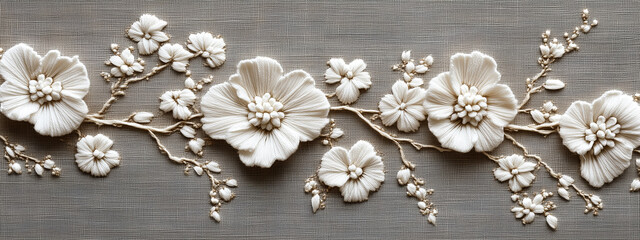 A classic floral embroidery in monochrome white threads creating texture on an eggshell background