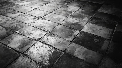 Textured grunge cement floor with dark tones and weathered tiles creating a moody and industrial atmosphere suitable for various design projects