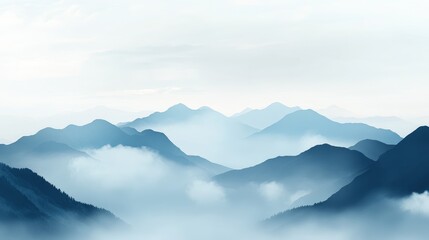 Fototapeta premium Serene mountain landscape with fog drifting over peaks under a cloudy morning sky creating a tranquil and ethereal atmosphere.