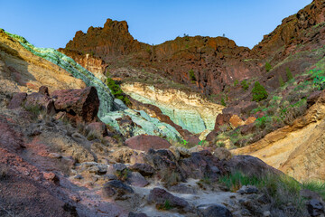Detail of the colors in the Natural Monument Azulejos de Veneguera or Rainbow Rocks in Mogan, Gran Canaria