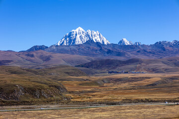 Tagong Grassland under the snow mountain of Ganzi Yala, Sichuan Province, China