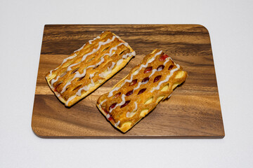  sweet and delicious strawberry  pastry on a wooden board