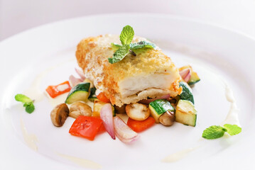 fries fish with organic vegetables