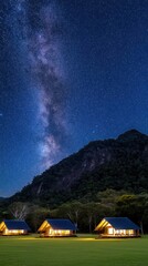 Camping beneath a dazzling starry sky in Chiang Phillip, Thailand, with tents glowing softly in the dark landscape