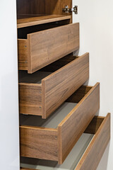 Empty shelves in white wooden rack, close up