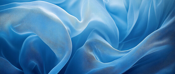 Fototapeta premium Soft blue fabric draping with gentle waves and textures.