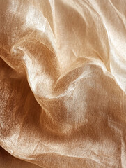 Close-up of crumpled, shimmering golden fabric.