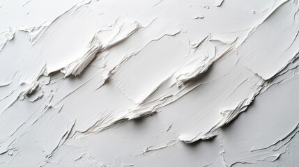 Obraz premium A textured white surface with layered paint, suggesting artistic application.