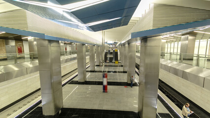 Obraz premium Interior of a modern subway station with trains timelapse hyperlapse
