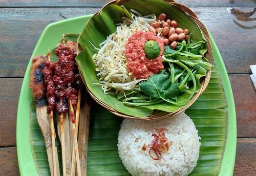 Typical food from Lombok Island is Plecing Kangkung and Sate Pusut