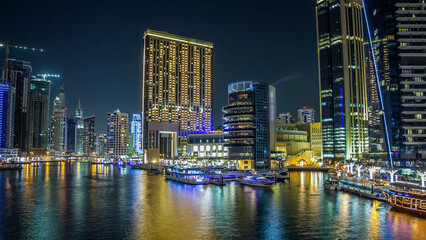Obraz premium Dubai Marina towers and canal in Dubai night timelapse hyperlapse