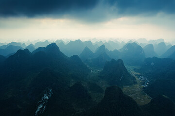 Sunlight shining over stacked mountain range on remote wilderness in countryside at Vietnam
