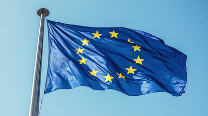 European Union Flag Waving on a Flagpole Against Clear Blue Sky