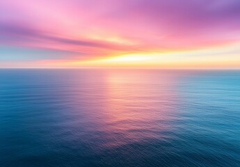 Obraz premium From an aerial perspective, the sunset sky reveals nature's splendor with the radiant light of a sunset or sunrise over the ocean, displaying a vivid, majestic scenery with stunning clouds and waves
