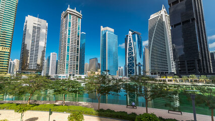 Obraz premium Residential buildings in Jumeirah Lake Towers timelapse hyperlapse in Dubai, UAE.
