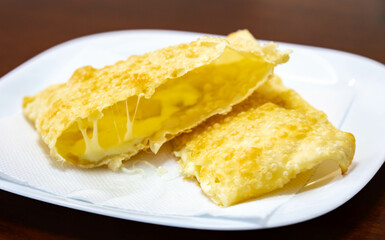 Traditional Brazilian fried cheese pastry known as pastel de feira