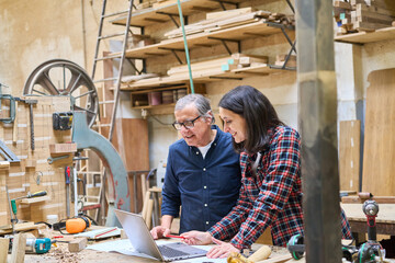 Teamwork in a lumberyard with young and older workers collaborating