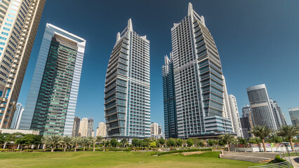 Obraz premium Residential buildings in Jumeirah Lake Towers timelapse hyperlapse in Dubai, UAE.