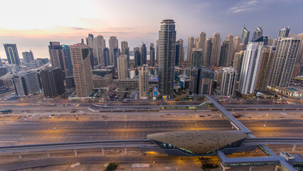 Aerial top view day to night timelapse of Dubai Marina and JLT in Dubai, UAE