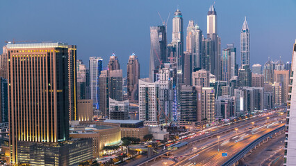 Aerial top view day to night timelapse of Dubai Marina and JLT in Dubai, UAE