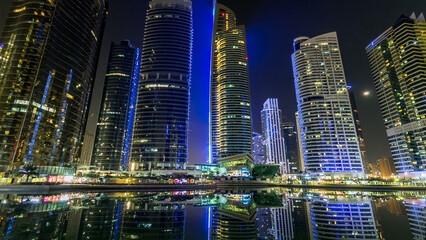 Obraz premium Residential buildings in Jumeirah Lake Towers timelapse hyperlapse in Dubai, UAE.