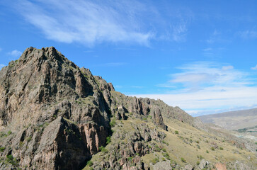 Fototapeta premium Rugged Mountain Landscape with Steep Slopes and Rocky Terrain
