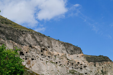 View of Vardzia caves. Vardzia is a cave monastery site in southern Georgia, excavated from the slopes of the Erusheti Mountain on the left bank of the Kura River. Travel for tourists