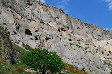 View of Vardzia caves. Vardzia is a cave monastery site in southern Georgia, excavated from the slopes of the Erusheti Mountain on the left bank of the Kura River. Travel for tourists