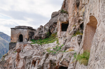 Naklejka premium View of Vardzia caves. Vardzia is a cave monastery site in southern Georgia, excavated from the slopes of the Erusheti Mountain on the left bank of the Kura River. Travel for tourists