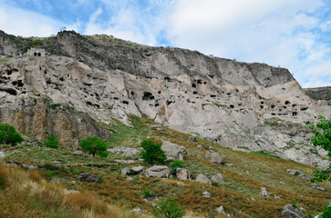 View of Vardzia caves. Vardzia is a cave monastery site in southern Georgia, excavated from the slopes of the Erusheti Mountain on the left bank of the Kura River. Travel for tourists