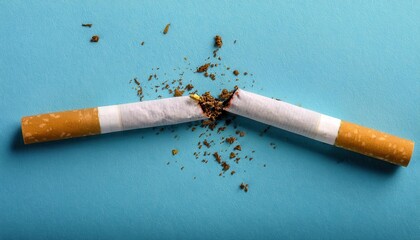 Broken Cigarette on Blue Background Symbolizing Quitting Smoking, Breaking Bad Habits, Healthy Lifestyle Change, Anti Smoking Awareness, Tobacco Addiction Recovery, and New Year's Resolutions Success