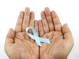 Blue ribbon on white background prostate cancer awareness concept