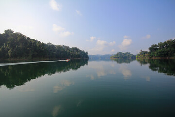 Clear bright blue sky, sunny day with lake and reflection, panoramic landscape