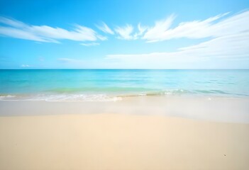 Fototapeta premium A serene beach with golden sand, calm turquoise waters, and a clear blue sky with wispy clouds