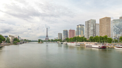 Fototapeta premium The Statue of Liberty and the Eiffel Tower timelapse hyperlapse with modern buildings. Paris, France