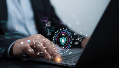 Business professional using a laptop with advanced cybersecurity interface. Digital icons representing secure data, encryption, and protection overlay the scene, emphasizing technological innovation