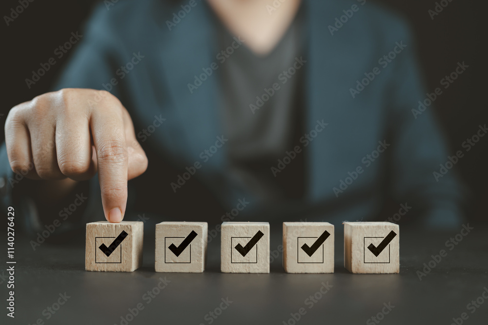 Poster task checklist, list survey, and assessment form online. hand holding a wooden cube with checkmark a