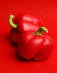 red bell pepper on a red background