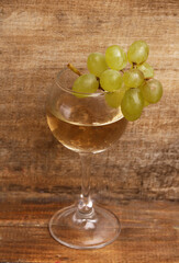glass of white wine on a light background