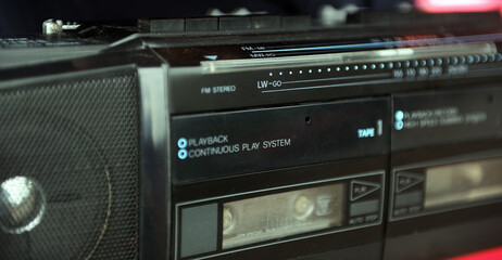 Old cassette recorder. Side view. 1990s.