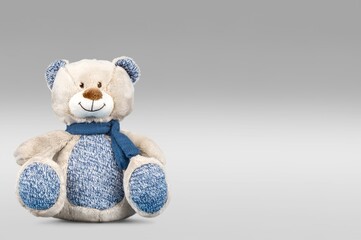 Cute toy Teddy bear on background