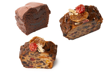 A cake with dried fruits, raisins almonds, dried strawberry.