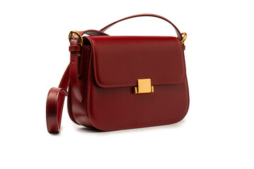 Burgundy shoulder leather bag isolated on white background.