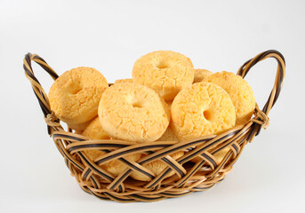 Cheese biscuit, homemade traditional Brazilian snack ( biscoito de queijo ) on bambu basket isolated on white background.