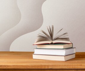 stack of old reading books on background